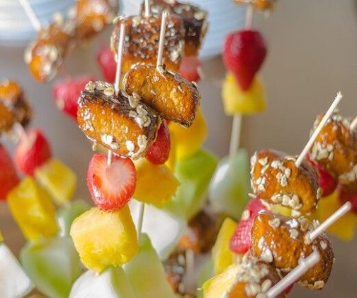 Sweet cinnamon pretzel bite and fruit skewers photo